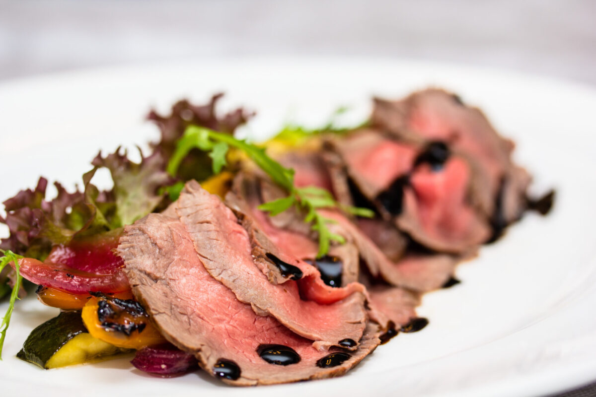 Roast beef is on the plate.